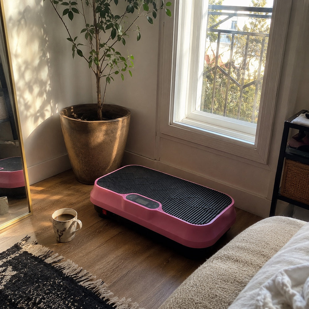 The pink Nuvé plate by a sunny bedroom window next to a cup of coffee